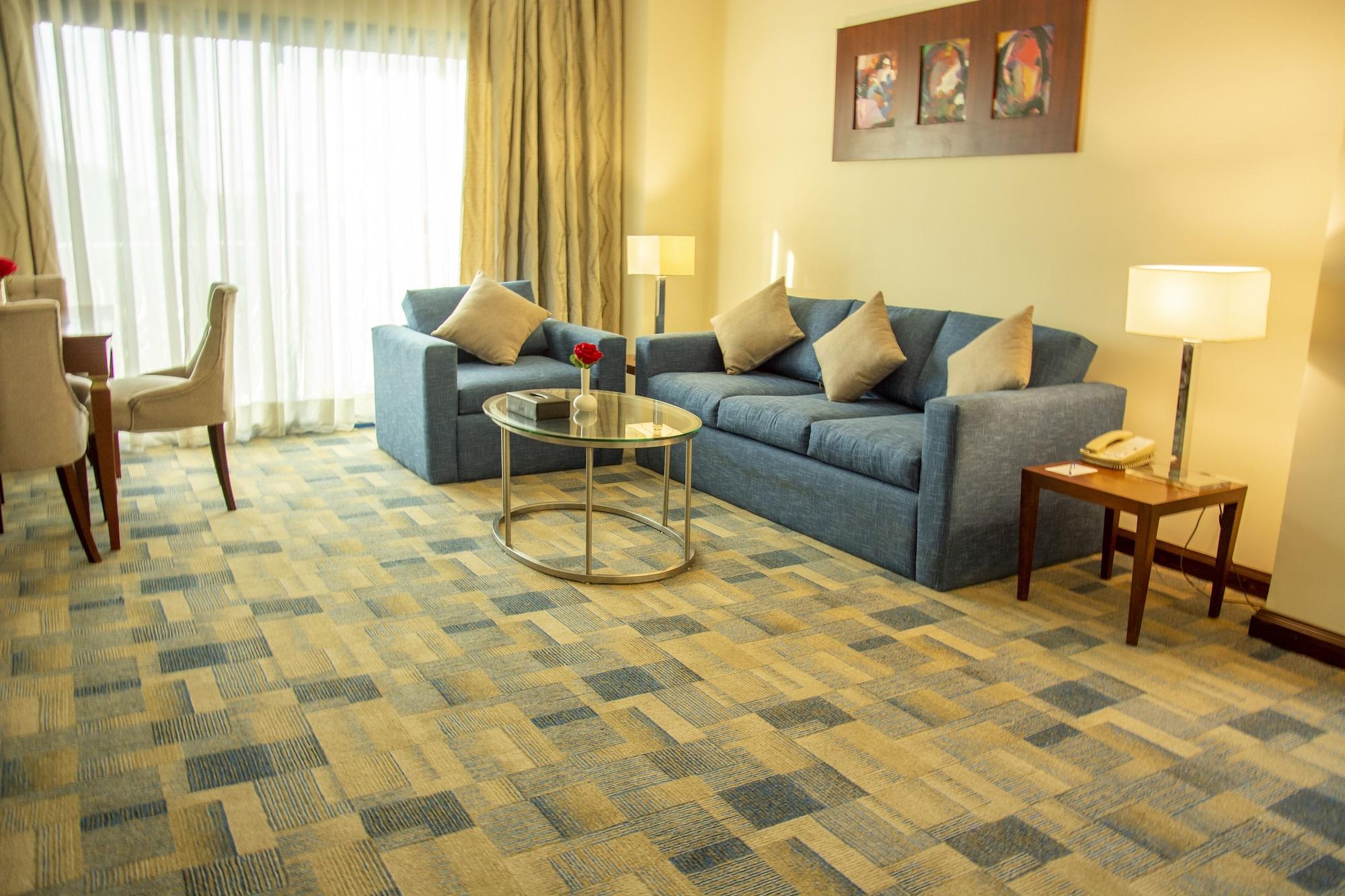 Helnan Dream Hotel And Conference Center 6th of October City Екстериор снимка A living room with carpet flooring